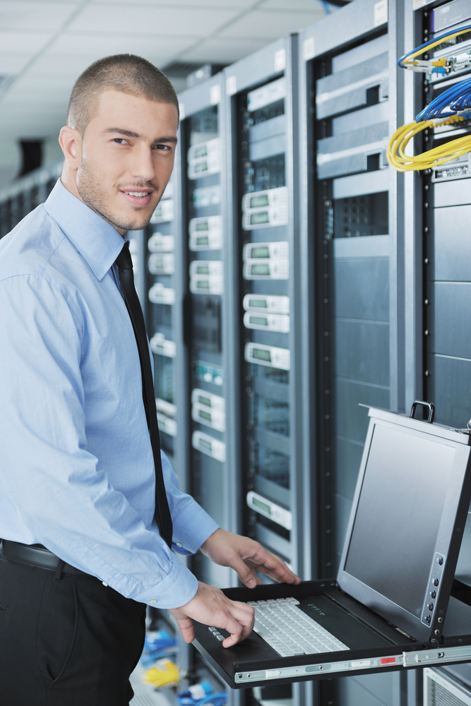 young handsome business man  engeneer in datacenter server room